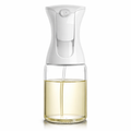 Clear spray bottle with white top on a white background