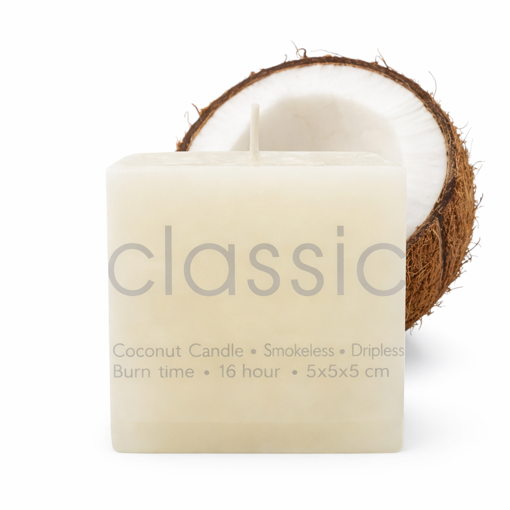 Coconut candle with a half-coconut on a white background