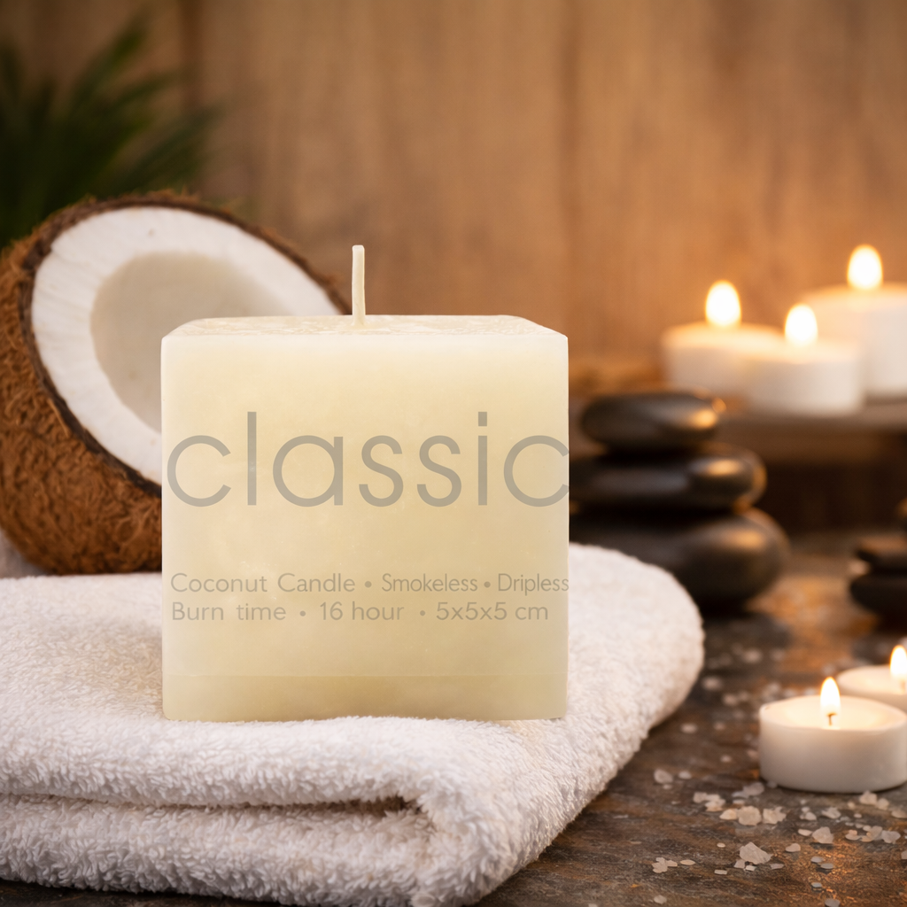 Coconut candle labeled 'classic' on a towel with stones and coconuts in the background