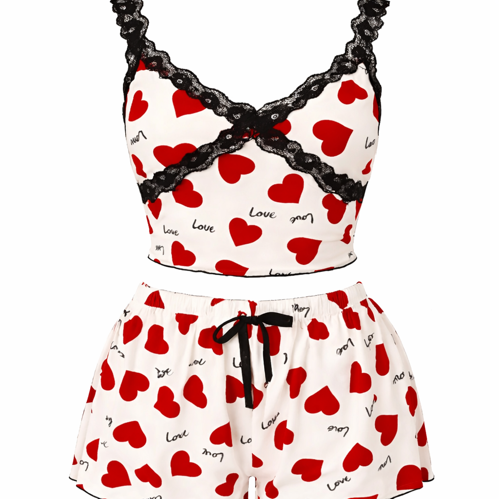 Pyjama set with red heart patterns and black lace details on a white background